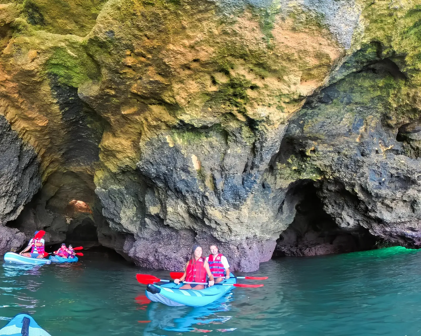 Kayakers exploring the Pirate Cave along the Algarve coast